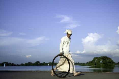 Moe Satt "Bicycle Tyre Rolling Event from Yangon: Bank of Innya Lake", 2013, Photograph, 600 x 910 mm