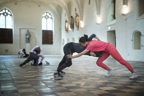 Cally Spooner, "On False Tears and Outsourcing" – dancers responsible for delivering self-organized efforts to resolve difficult and time-consuming issues “go the distance” across multiple overlapping phases using appropriated competitive strategies and appropriated intimate gestures, 2015. Installation view: Vleeshal Markt, Middelburg, the Netherlands. Courtesy Vleeshal Markt, Middelburg, the Netherlands. Photo: Anda van Riet